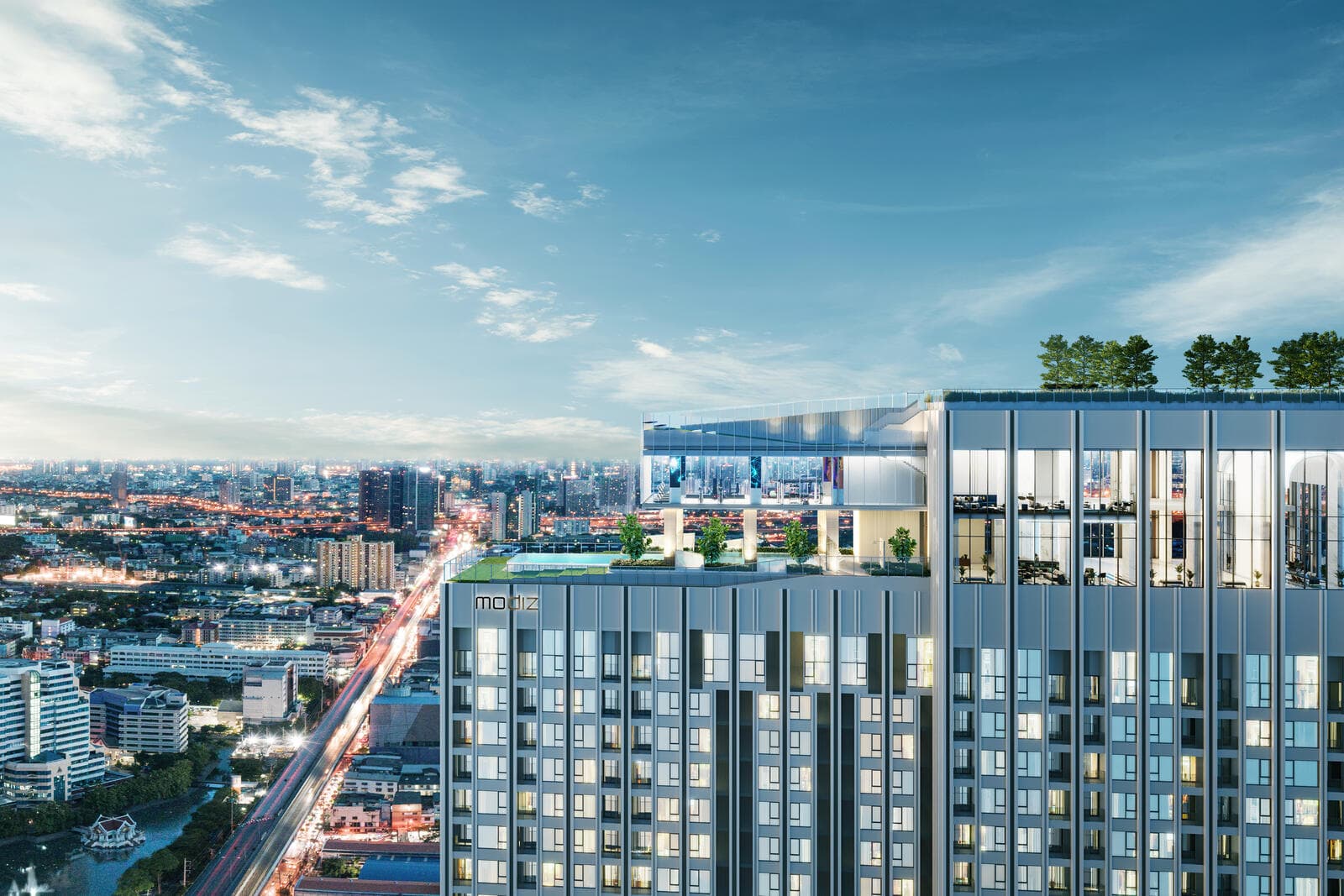 Upper floors and rooftop level of Modiz Rhyme Ramkhamhaeng at dusk, showing the pool deck, glazed sky lounge and roof trees above the lit Ramkhamhaeng road corridor (computer-generated render)