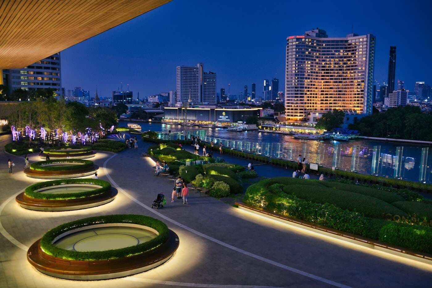 Chao Phraya riverfront terrace at blue hour