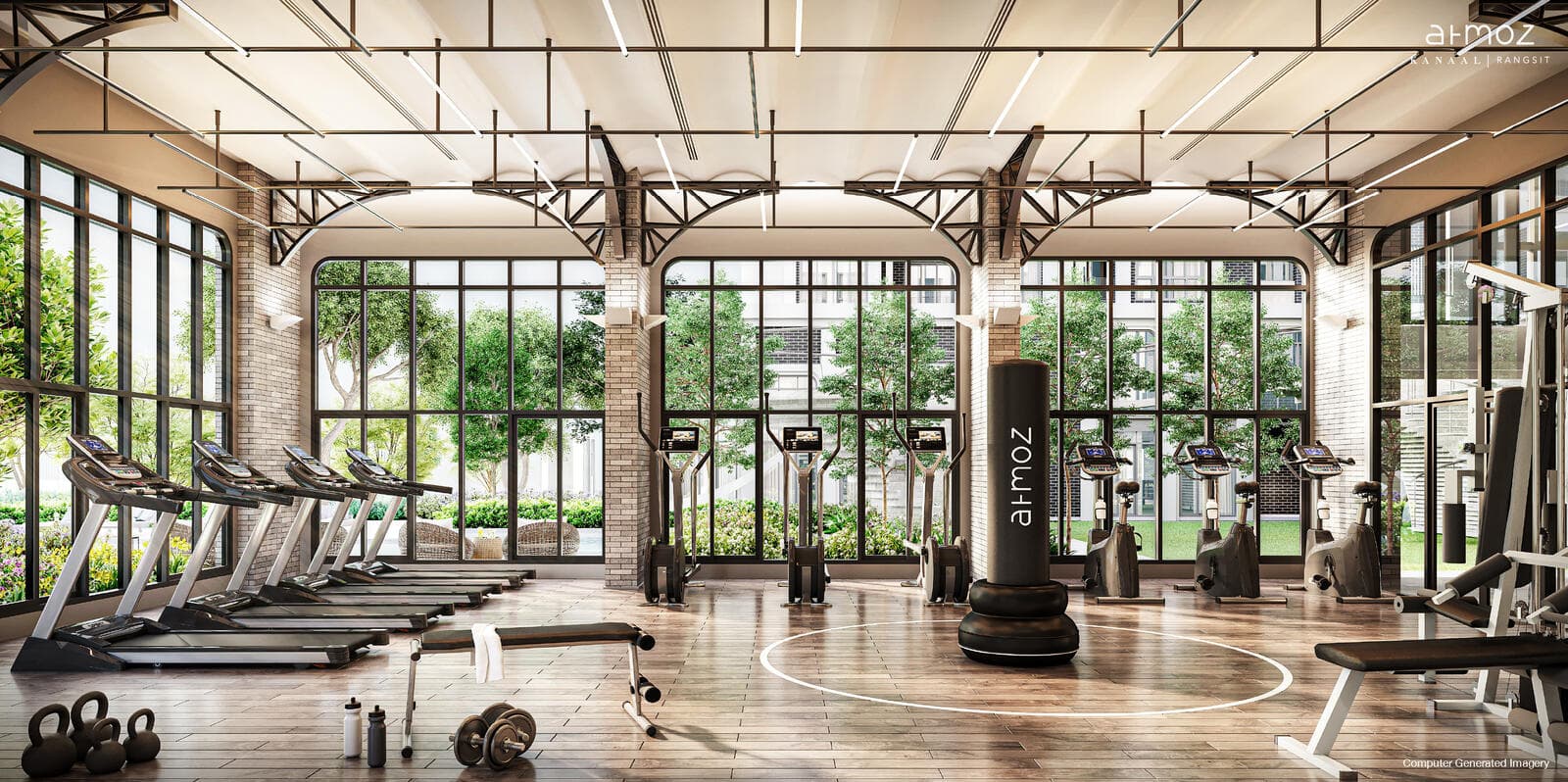 Fitness studio at Atmoz Kanaal Rangsit with treadmills, exercise bikes and free weights on a timber floor beneath a steel-truss ceiling and tall arched windows onto the courtyard (developer computer-generated image)